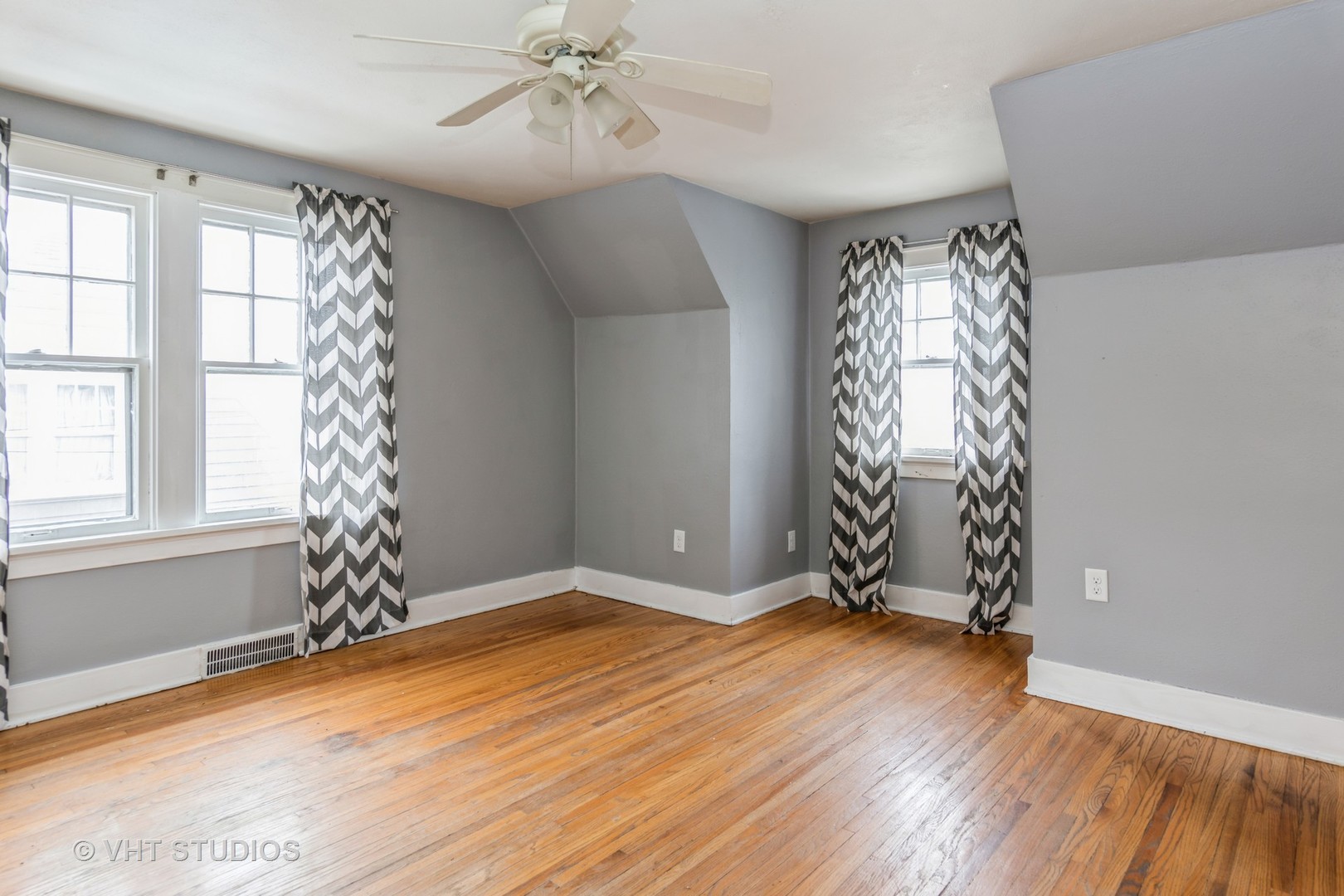 1116 Sycamore Road DeKalb, IL 60115 - Photo 9 of 10 wooden floor in an empty room with a window