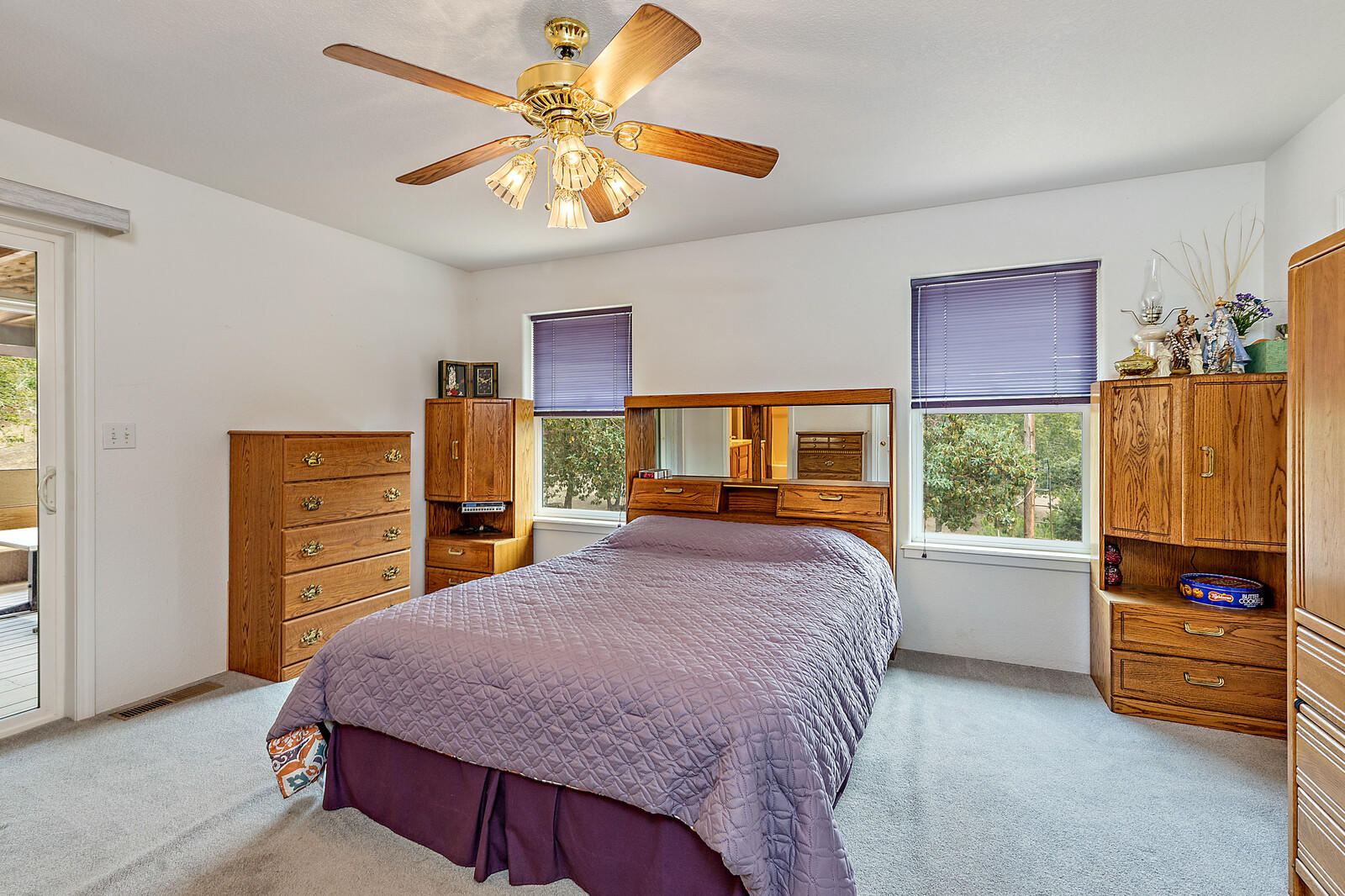 9996 Blackwell Road Central Point, OR 97502 - Photo 14 of 46 a bedroom with a bed dresser and a window