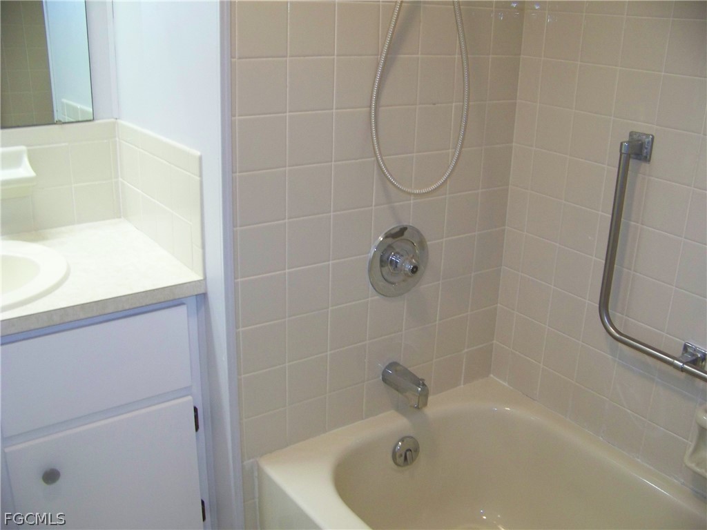15550 Burnt Store Road, Unit 202 Punta Gorda, FL 33955 - Photo 29 of 50 a bathroom with a bath tub with a shower