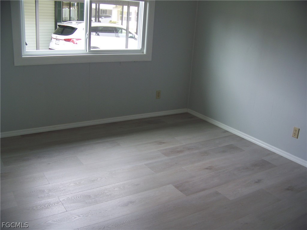15550 Burnt Store Road, Unit 202 Punta Gorda, FL 33955 - Photo 30 of 50 an empty room with a window