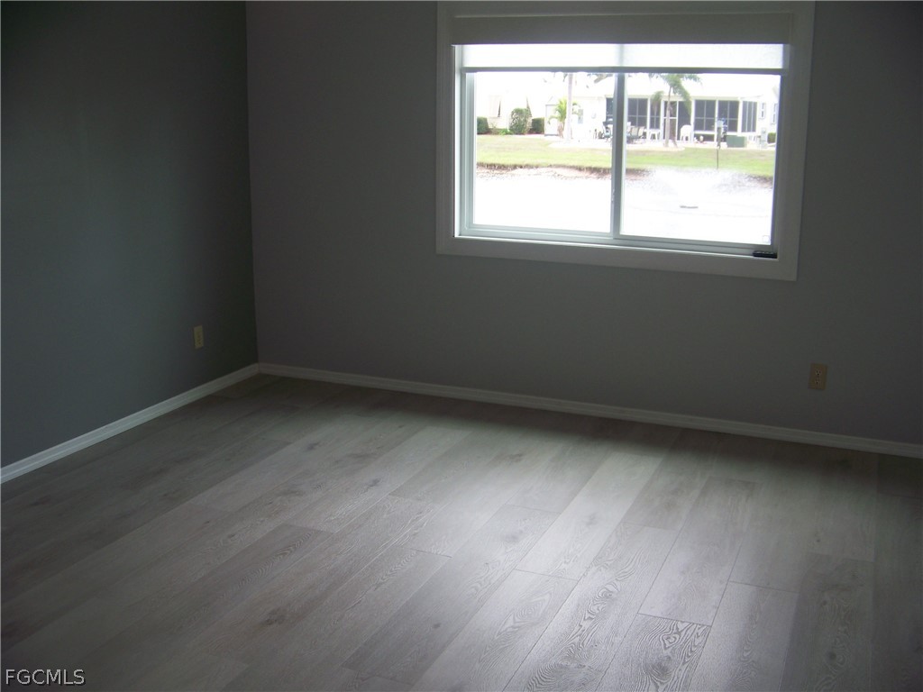 15550 Burnt Store Road, Unit 202 Punta Gorda, FL 33955 - Photo 32 of 50 an empty room with a window