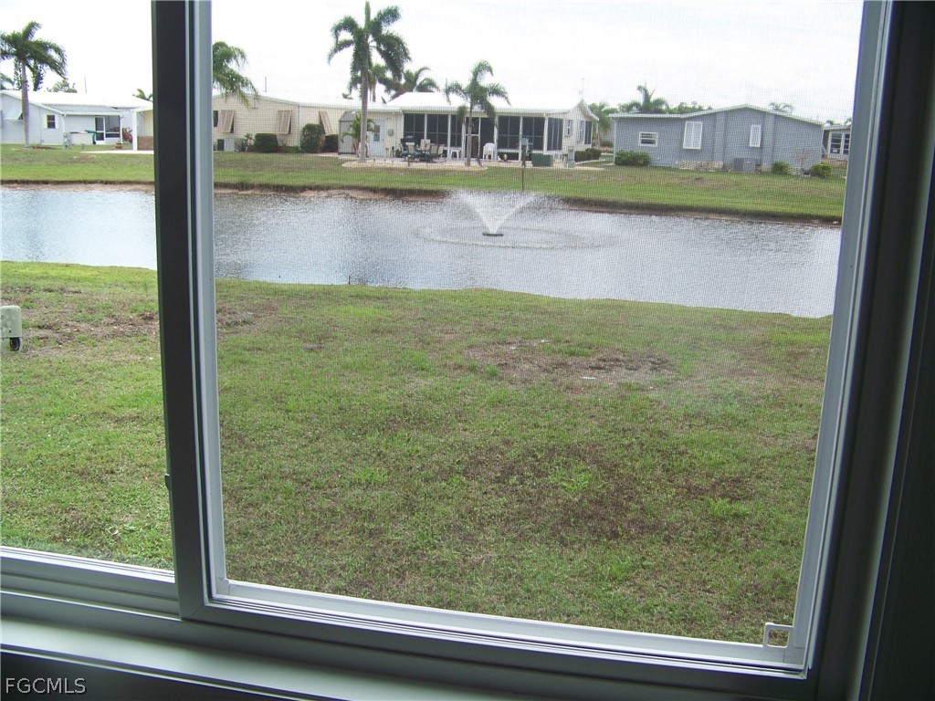 15550 Burnt Store Road, Unit 202 Punta Gorda, FL 33955 - Photo 33 of 50 a view of swimming pool from a window