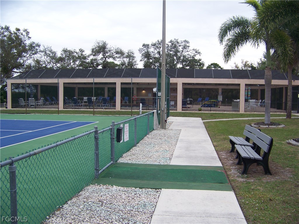 15550 Burnt Store Road, Unit 202 Punta Gorda, FL 33955 - Photo 48 of 50 a view of a house with a yard and sitting area