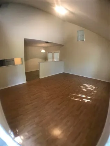a kitchen with a sink a stove and cabinets