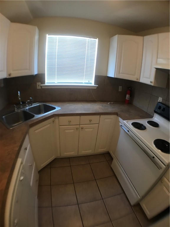 5603 Joe Sayers Avenue, Unit B Austin, TX 78756 - Photo 5 of 12 a kitchen with a sink a stove and cabinets