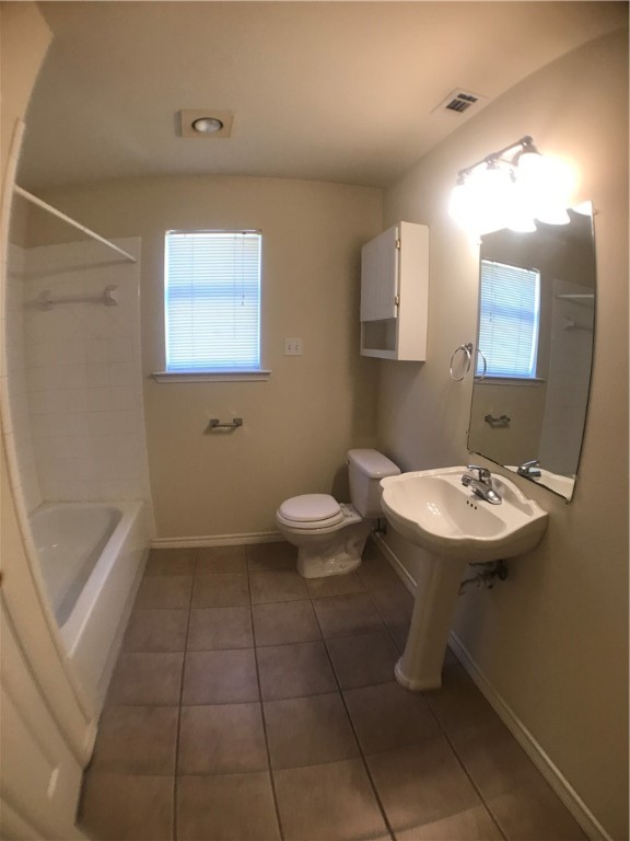 5603 Joe Sayers Avenue, Unit B Austin, TX 78756 - Photo 7 of 12 a bathroom with a sink a toilet and mirror