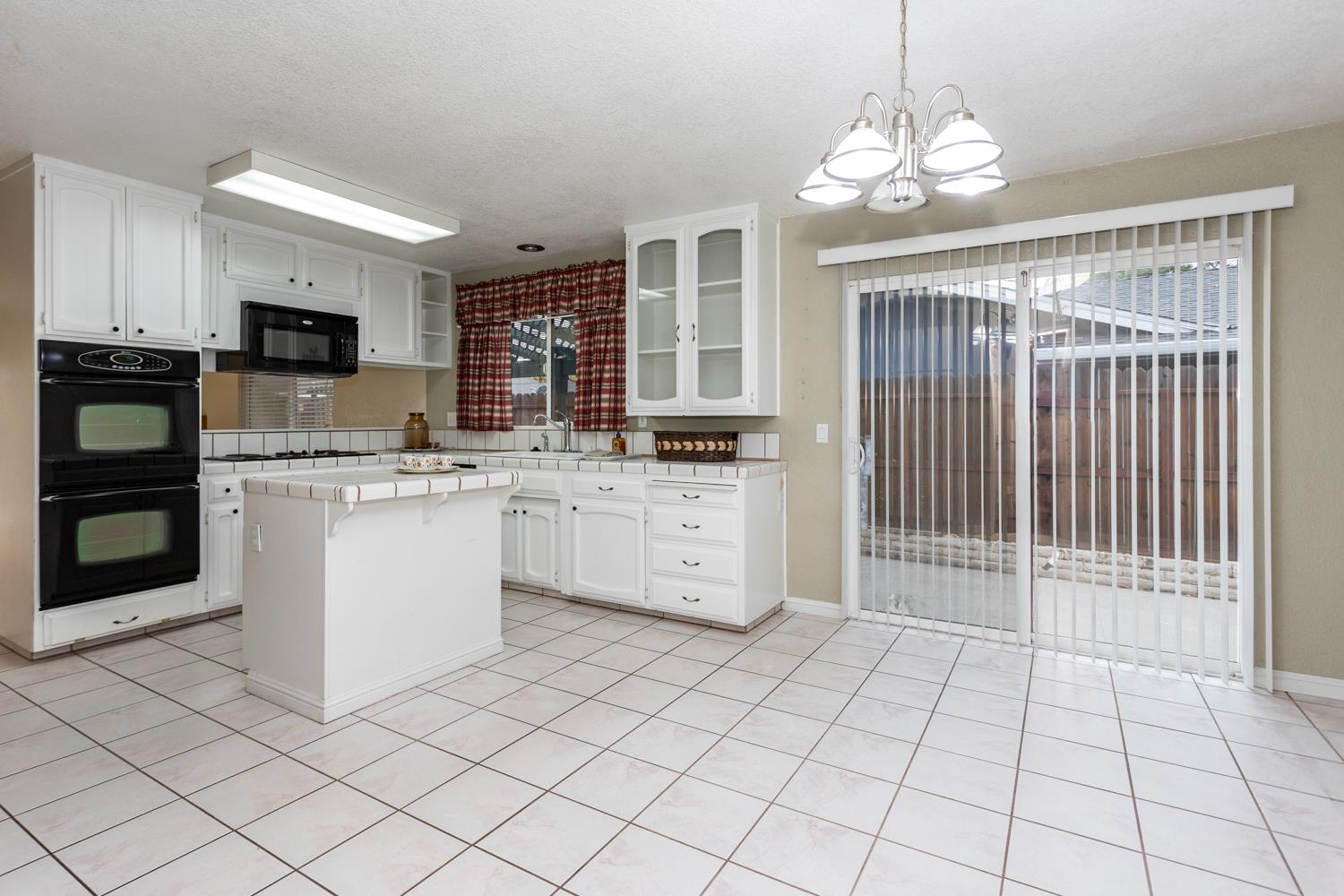 1505 Bandera Lane Modesto, CA 95355 - Photo 11 of 35 a kitchen with stainless steel appliances a sink and cabinets
