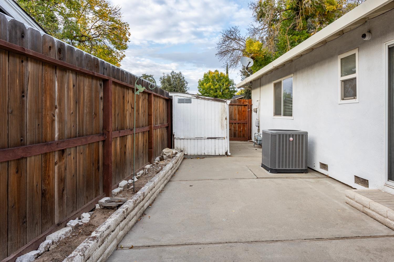 1505 Bandera Lane Modesto, CA 95355 - Photo 21 of 35 a view of a house with wooden fence