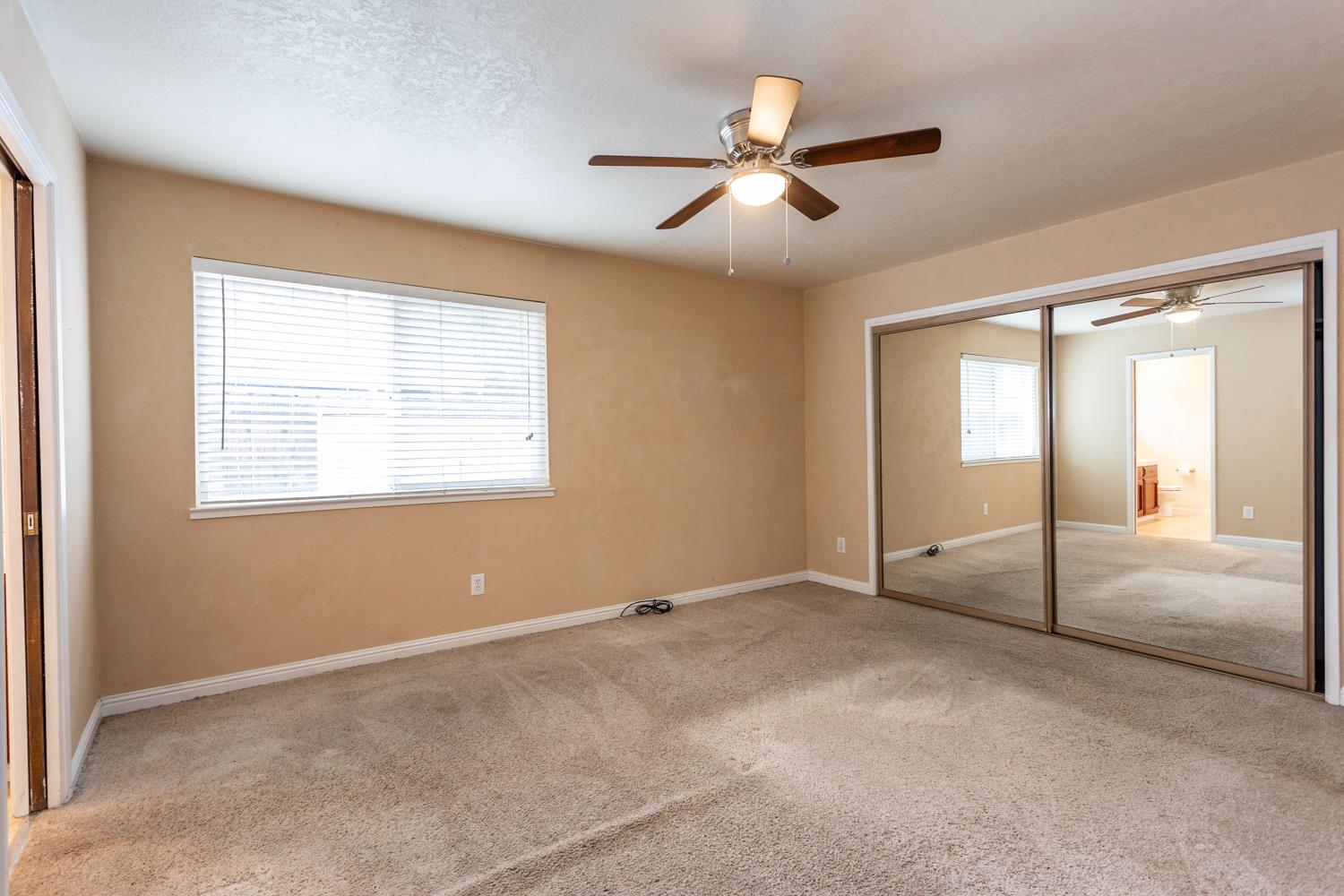 1505 Bandera Lane Modesto, CA 95355 - Photo 24 of 35 a view of an empty room with a window
