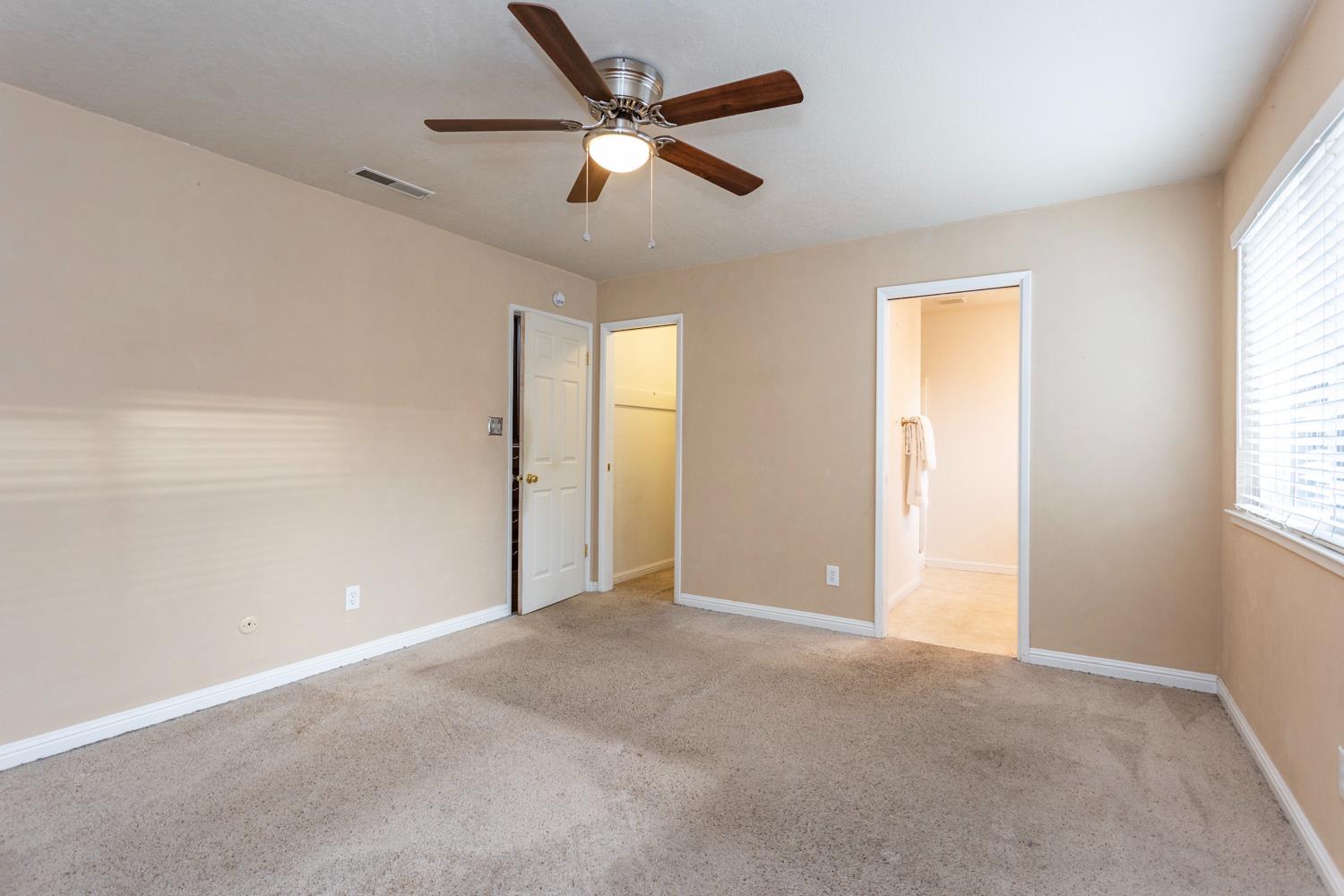 1505 Bandera Lane Modesto, CA 95355 - Photo 28 of 35 an empty room with fan and windows