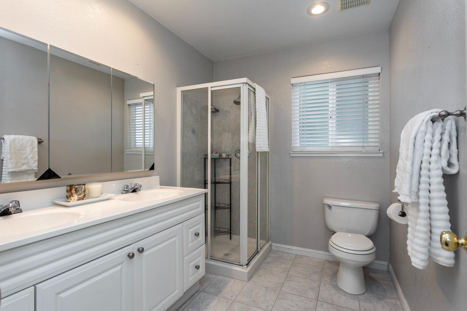 1505 Bandera Lane Modesto, CA 95355 - Photo 29 of 35 a bathroom with a toilet sink and shower