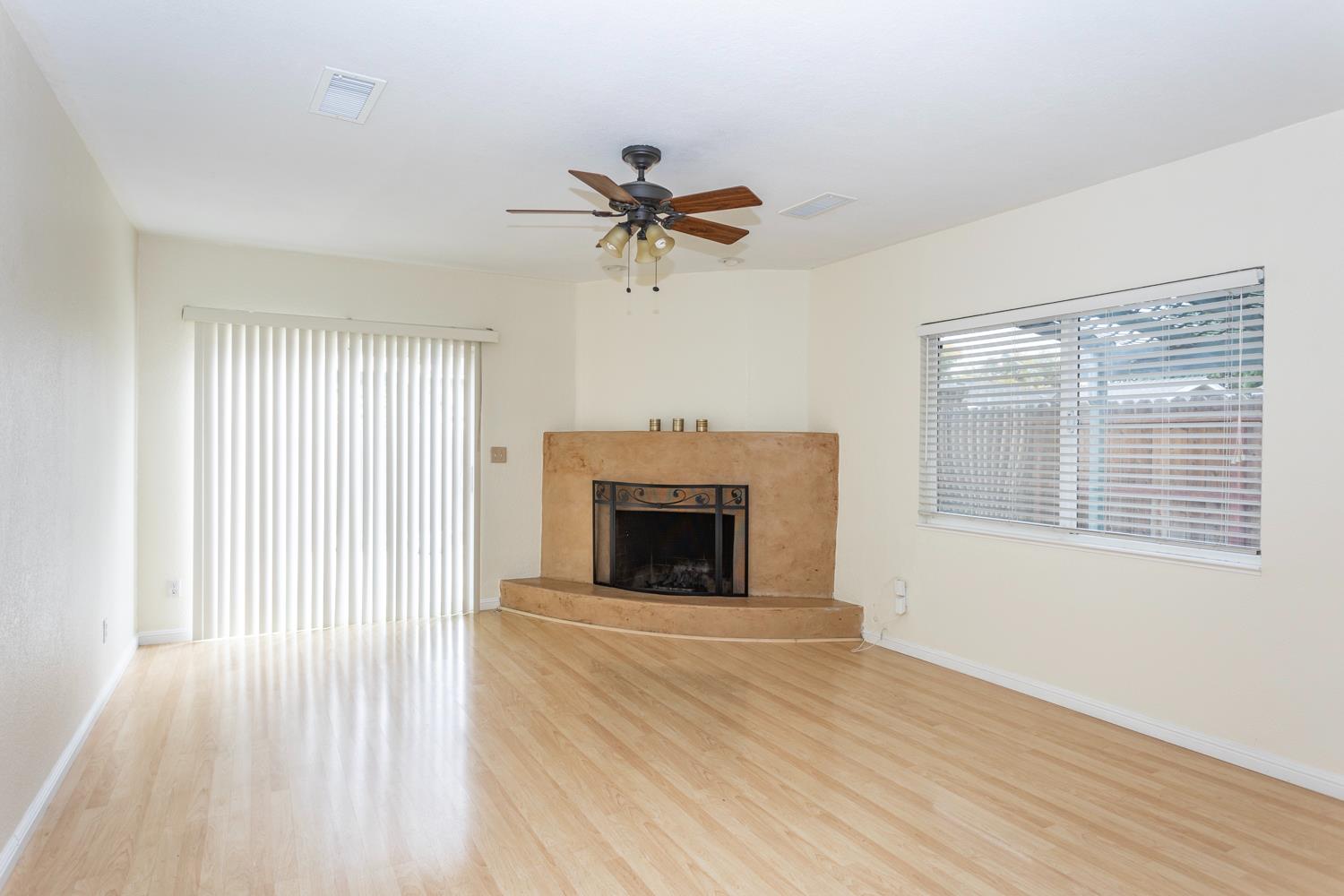 1505 Bandera Lane Modesto, CA 95355 - Photo 4 of 35 a view of a livingroom with a fireplace and window
