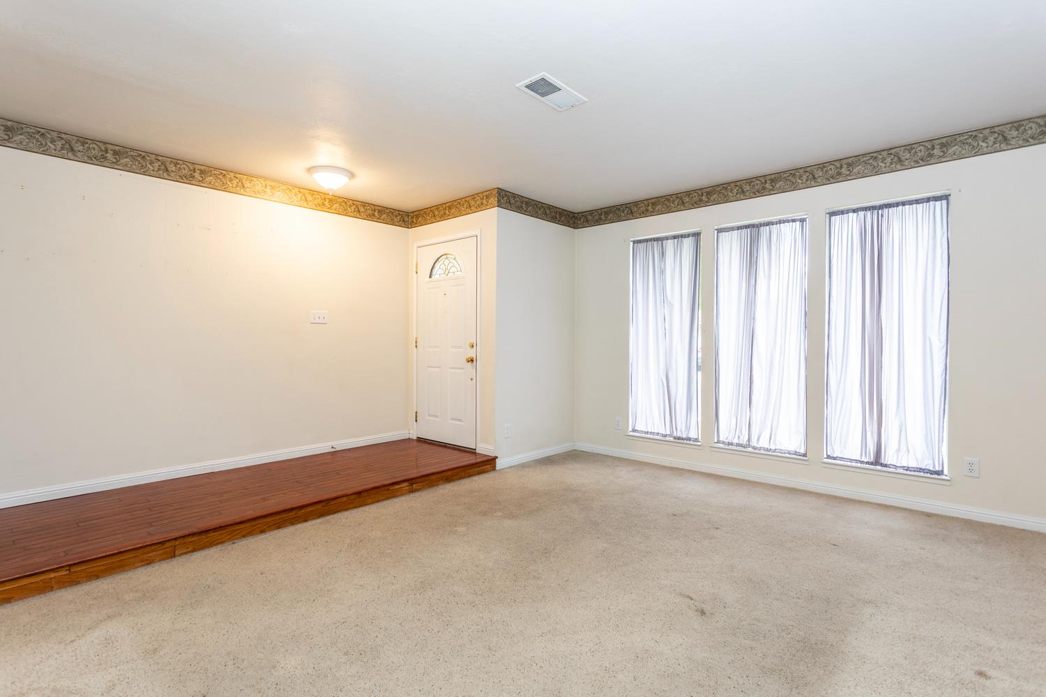 1505 Bandera Lane Modesto, CA 95355 - Photo 7 of 35 a view of an empty room with a window