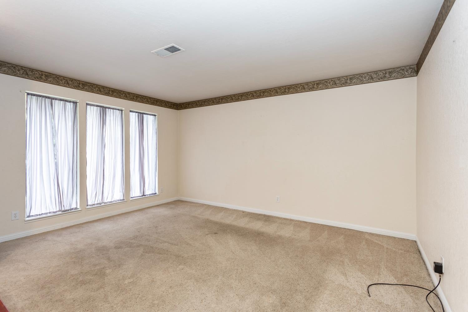 1505 Bandera Lane Modesto, CA 95355 - Photo 8 of 35 an empty room with windows