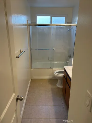 a bathroom with a shower and a toilet