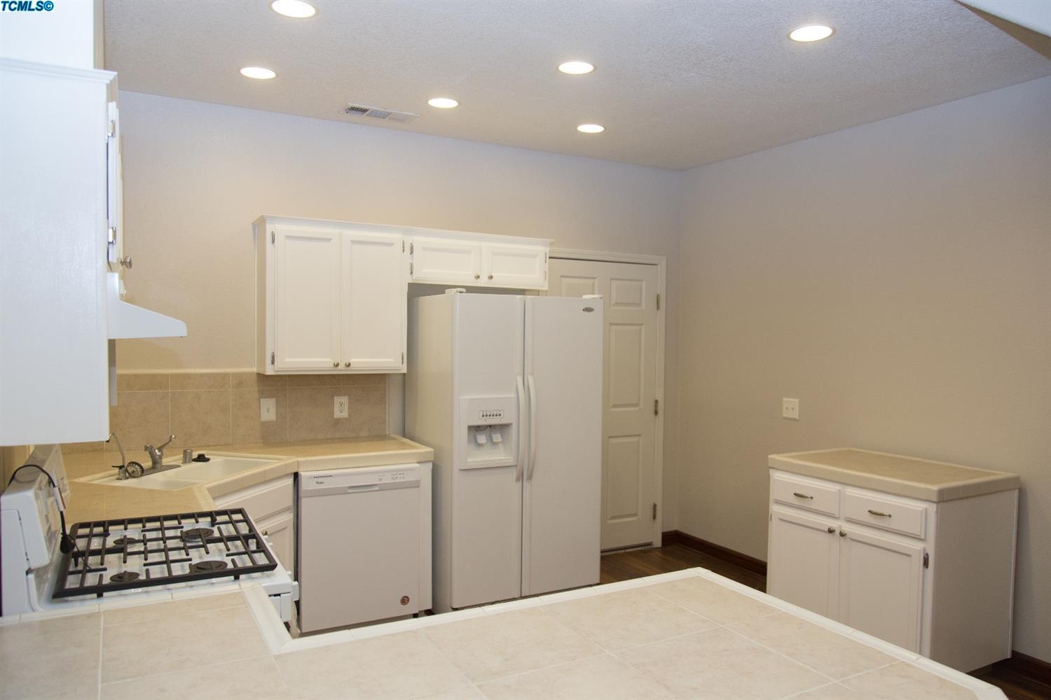 148 South Filbert Road Exeter, CA 93221 - Photo 3 of 23 a bedroom with a bed and a dresser