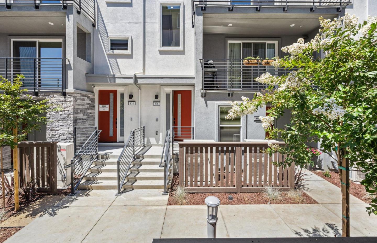 806 Redberry Way San Jose, CA 95117 - Photo 1 of 49 a view of a house with a small yard and wooden floor and fence