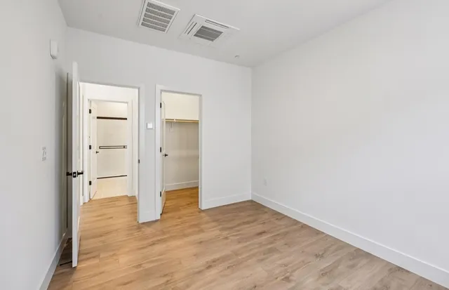 a view of a room with shelf on the wall