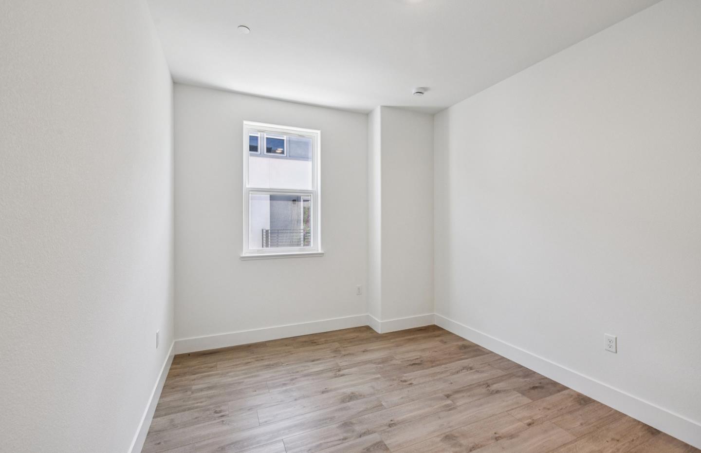 806 Redberry Way San Jose, CA 95117 - Photo 15 of 49 a view of an empty room with wooden floor