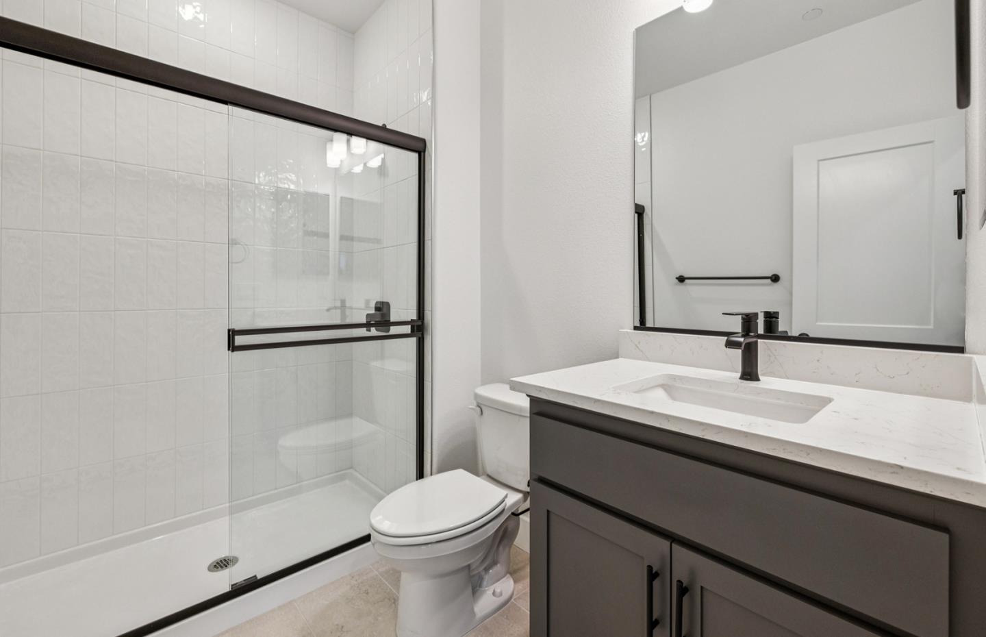 806 Redberry Way San Jose, CA 95117 - Photo 16 of 49 a bathroom with a sink a toilet and a mirror