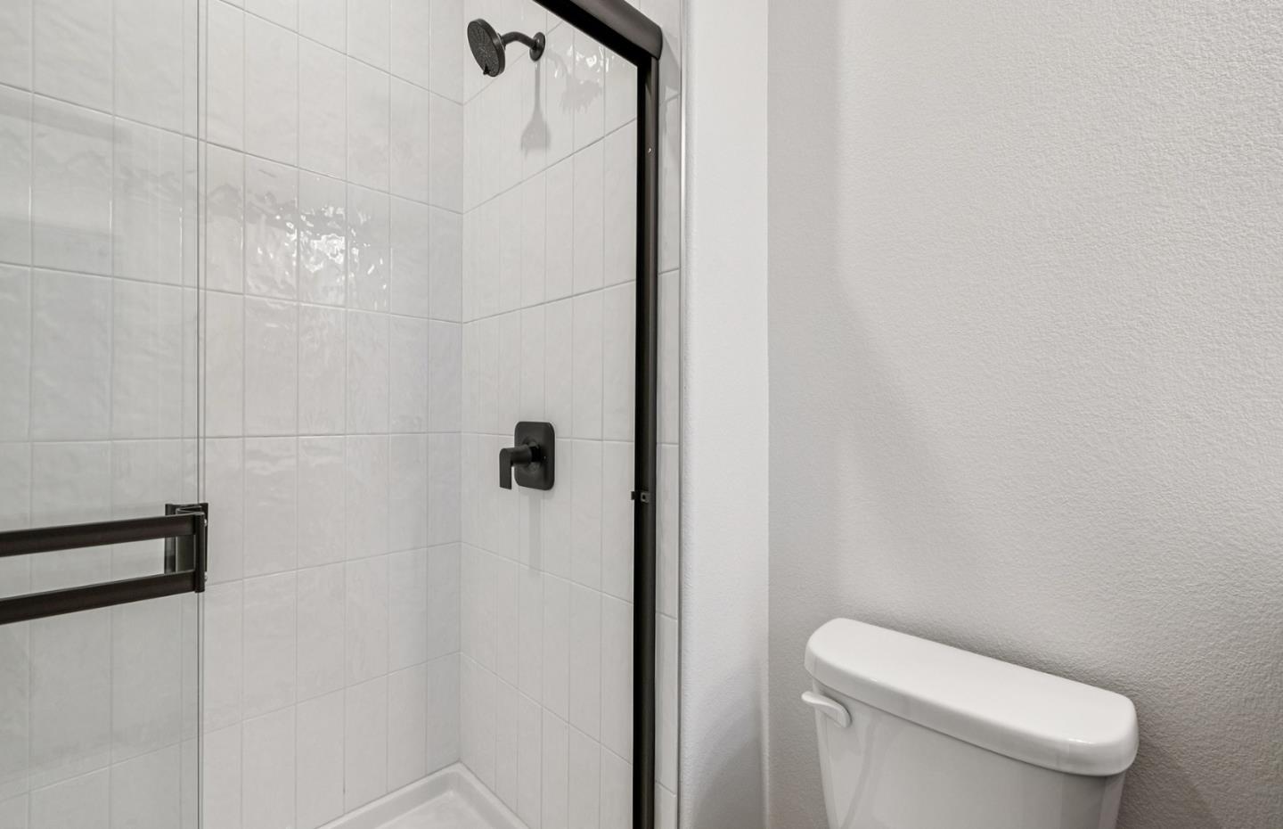 806 Redberry Way San Jose, CA 95117 - Photo 17 of 49 a white toilet sitting next to a shower