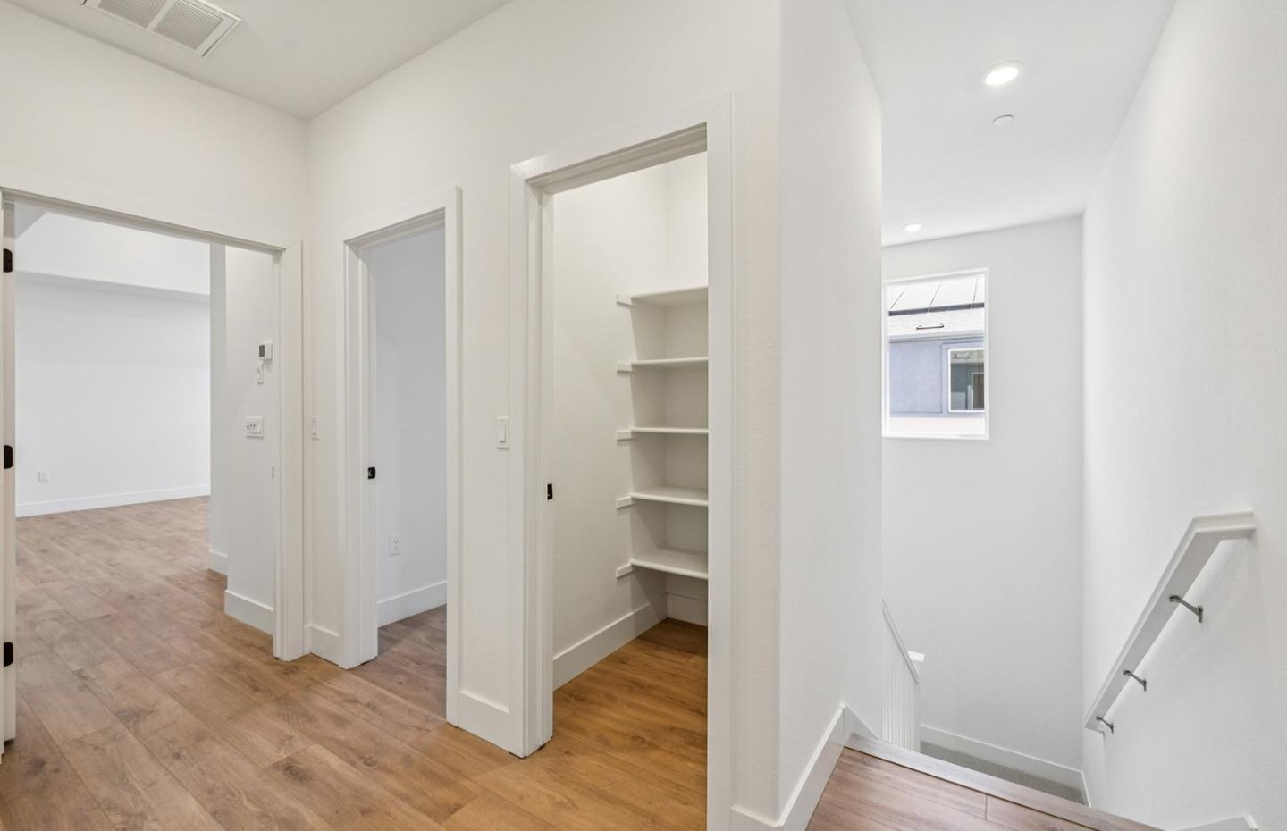 806 Redberry Way San Jose, CA 95117 - Photo 19 of 49 a view of a hallway with wooden floor and closet
