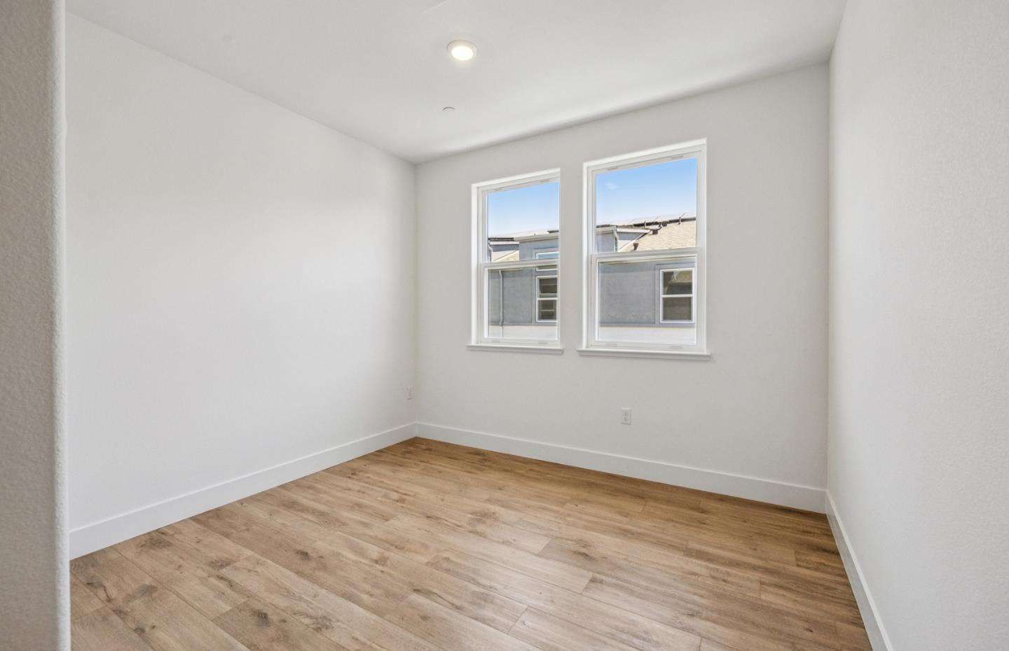 806 Redberry Way San Jose, CA 95117 - Photo 21 of 49 a view of empty room with wooden floor and fan