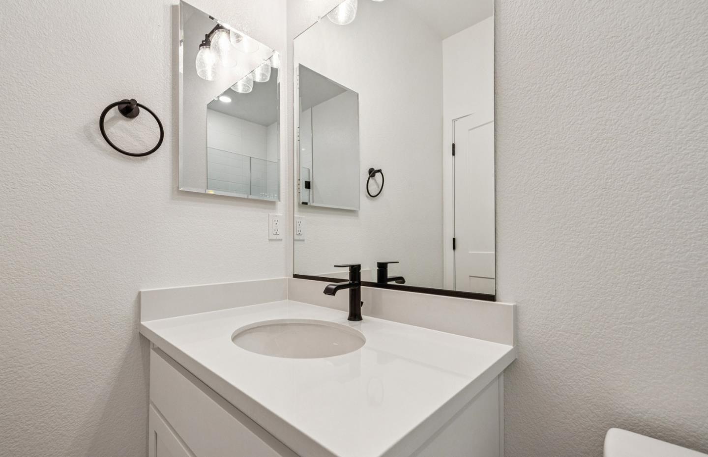 806 Redberry Way San Jose, CA 95117 - Photo 25 of 49 a bathroom with a sink and a mirror