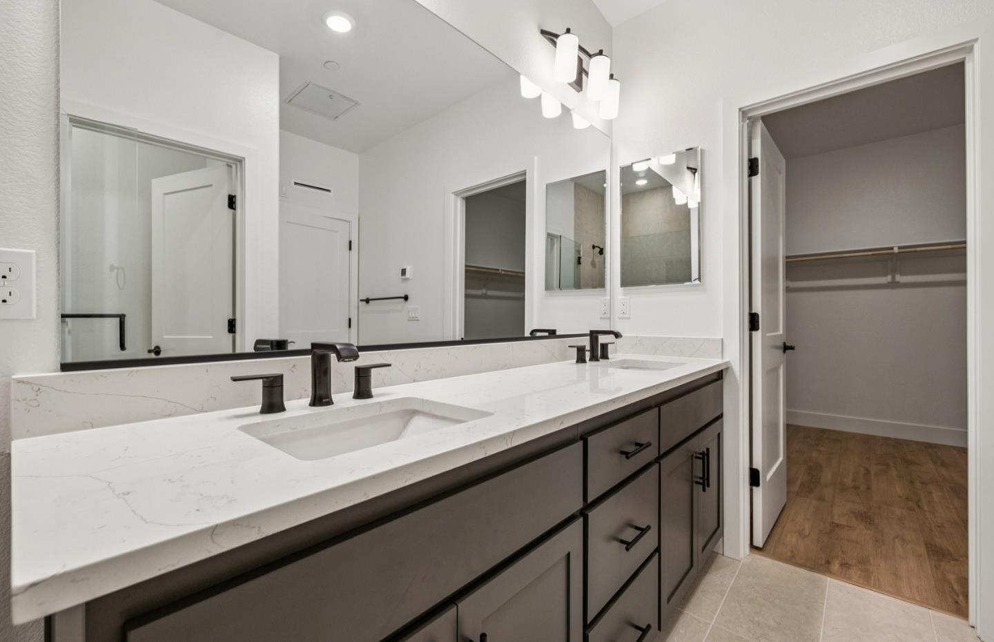 806 Redberry Way San Jose, CA 95117 - Photo 32 of 49 a bathroom with a sink double vanity and a mirror