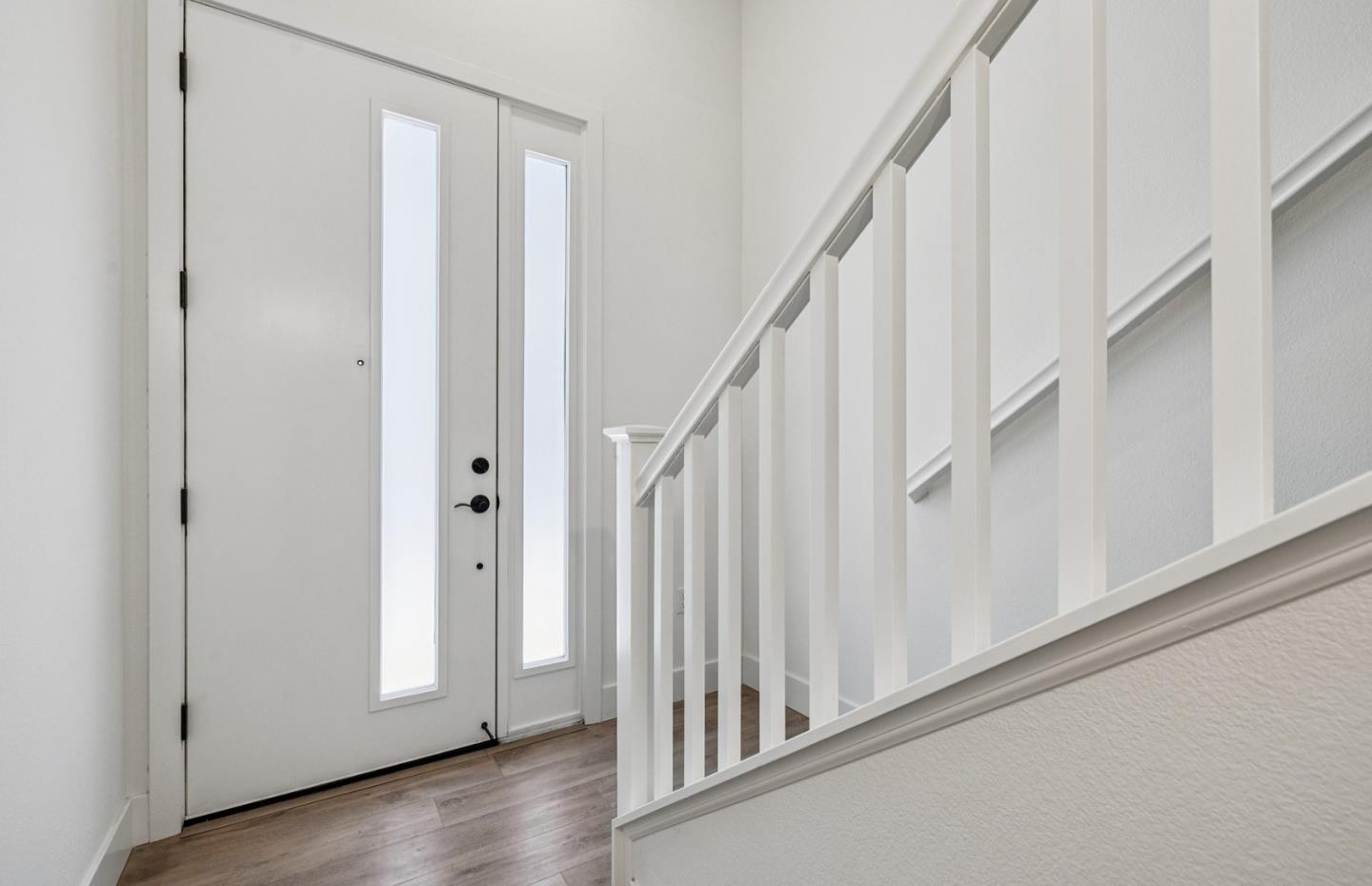 806 Redberry Way San Jose, CA 95117 - Photo 37 of 49 a view of a hallway with wooden floor and staircase