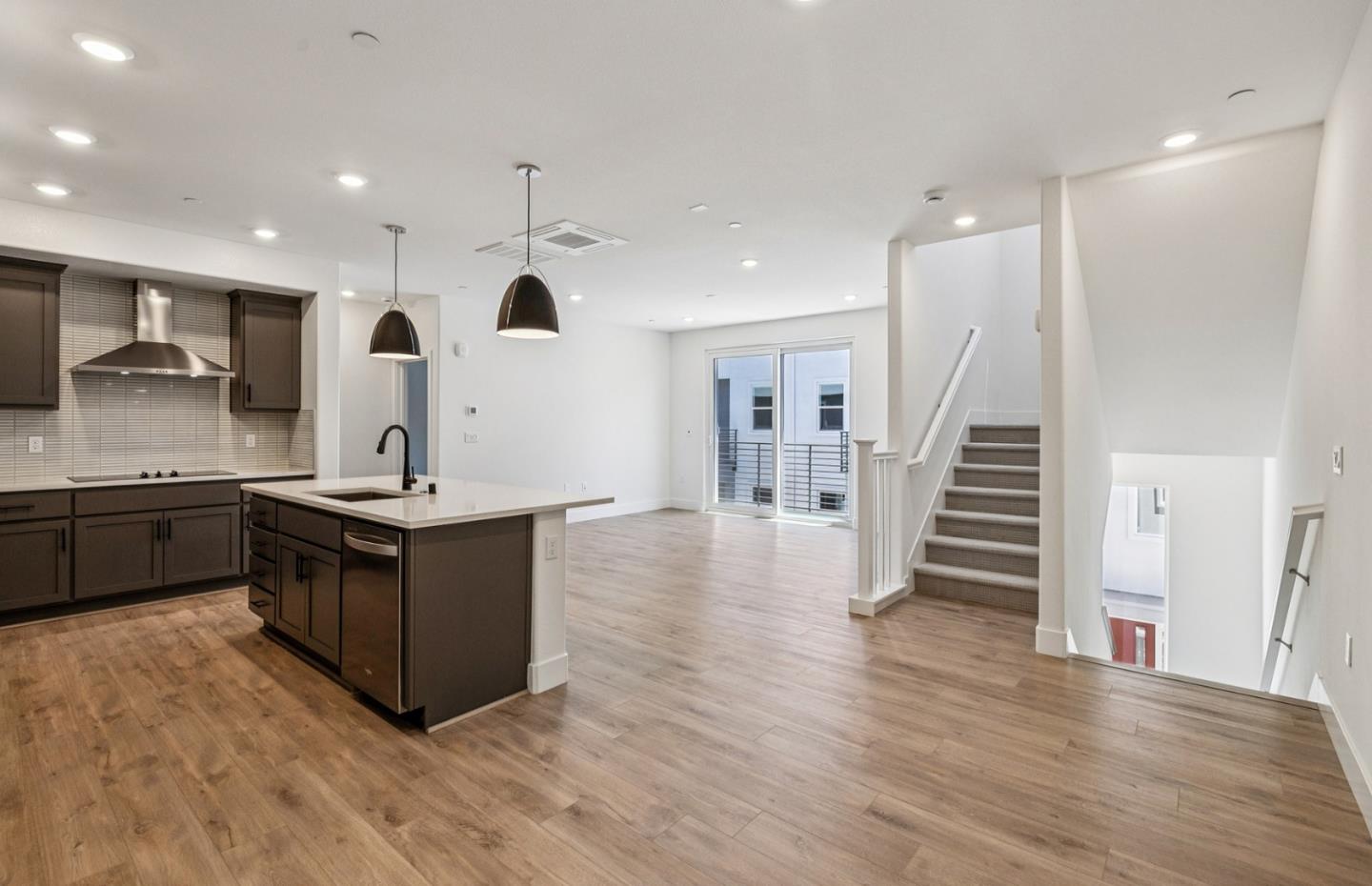 806 Redberry Way San Jose, CA 95117 - Photo 38 of 49 a kitchen with stainless steel appliances granite countertop a sink a stove and a wooden floors