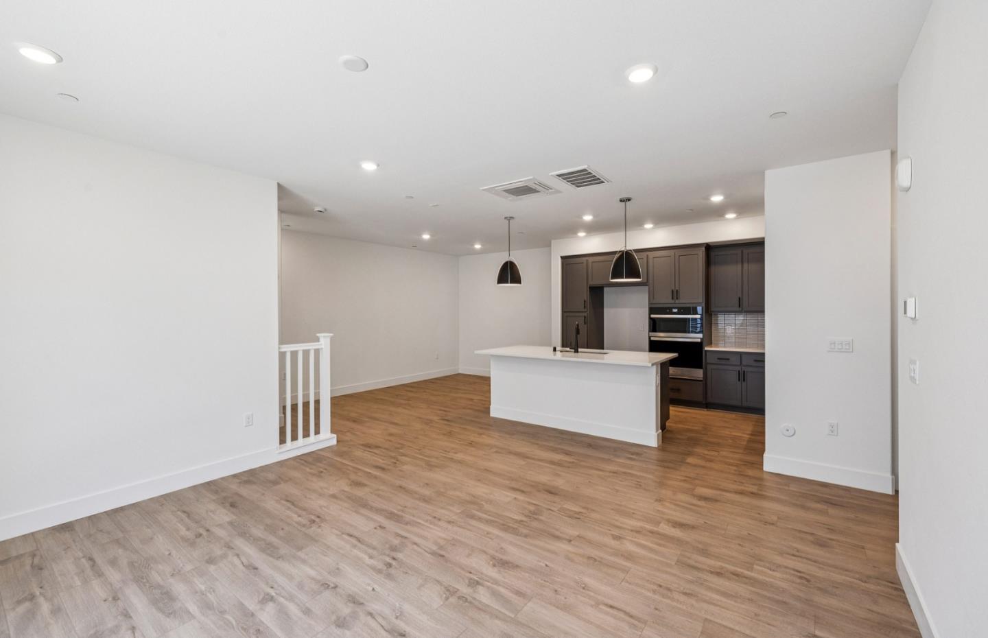 806 Redberry Way San Jose, CA 95117 - Photo 42 of 49 a large kitchen with a refrigerator and a wooden floor