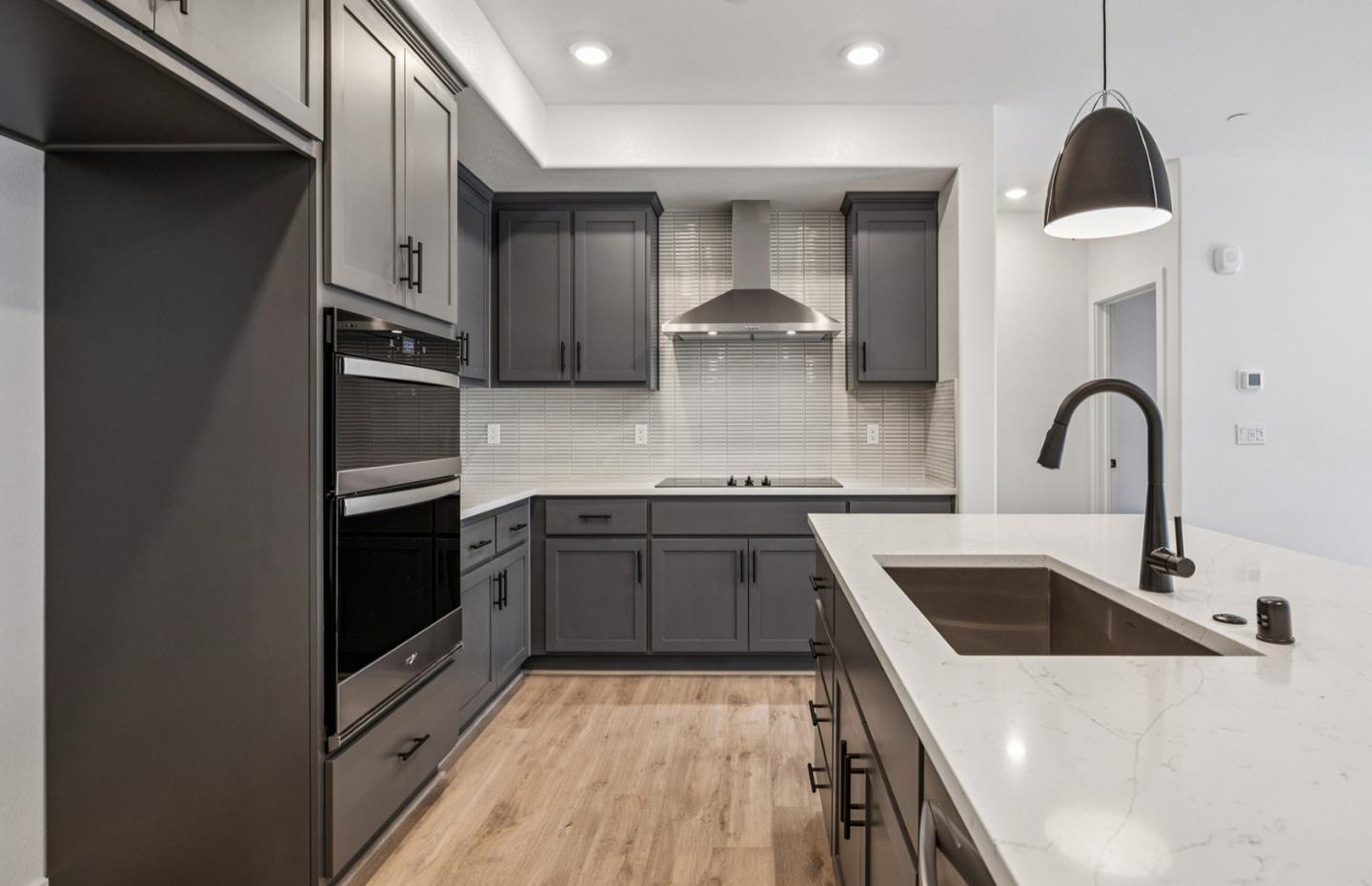 806 Redberry Way San Jose, CA 95117 - Photo 44 of 49 a kitchen with a sink and a stove top oven