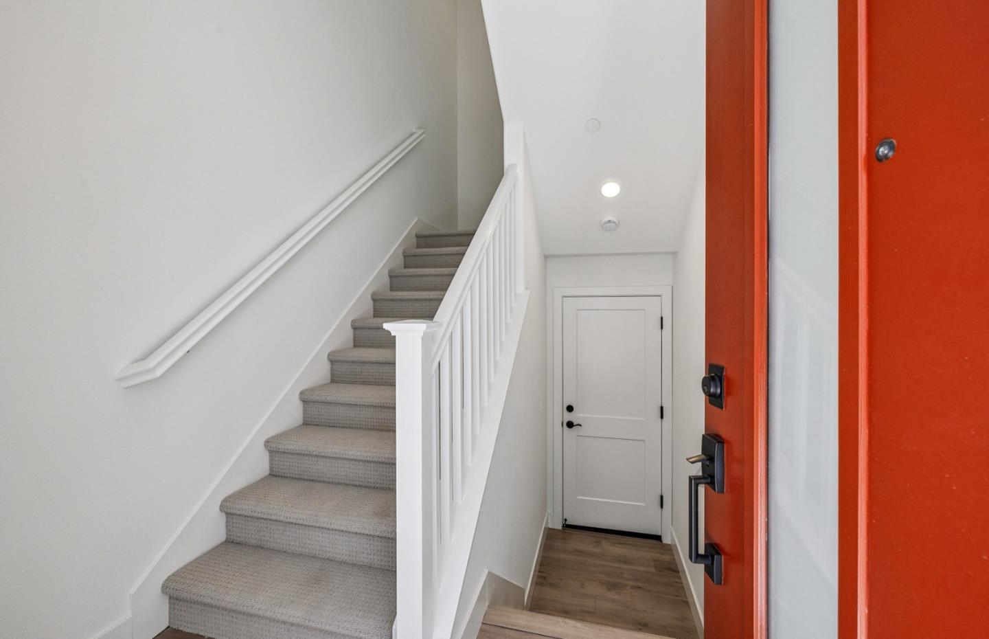 806 Redberry Way San Jose, CA 95117 - Photo 6 of 49 a view of a hallway with wooden floor and staircase