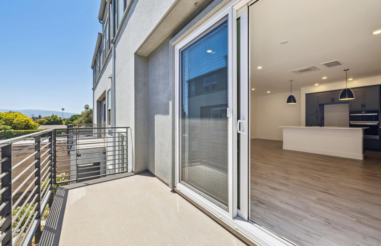 806 Redberry Way San Jose, CA 95117 - Photo 9 of 49 a view of a hallway with wooden floor and staircase