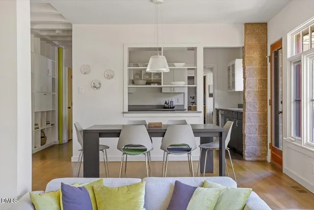 a view of a yard with plants and trees