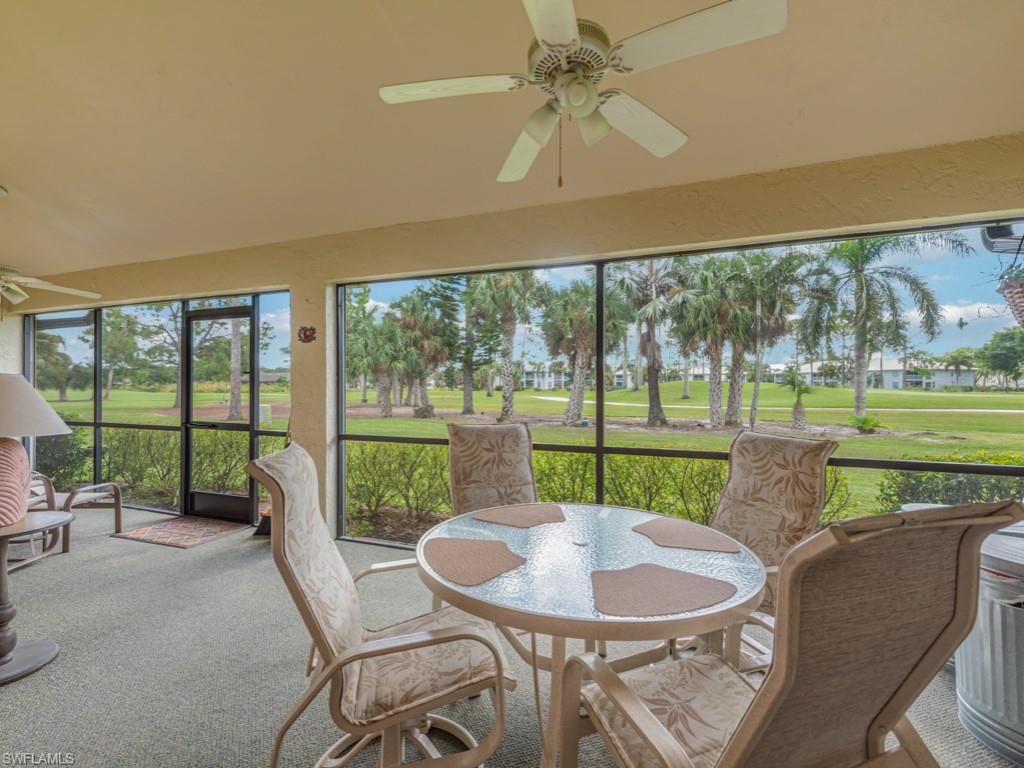594 Augusta Boulevard, Unit 3 Naples, FL 34113 - Photo 12 of 20 a dining room with furniture and a large window