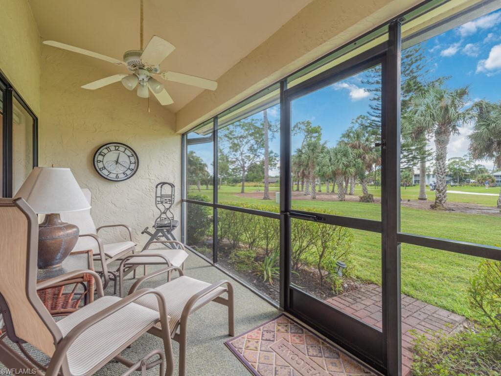 594 Augusta Boulevard, Unit 3 Naples, FL 34113 - Photo 15 of 20 a view of a dining room with furniture window and outside view