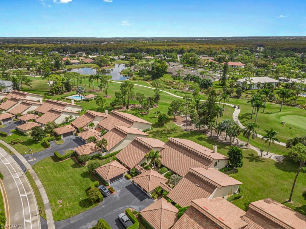 594 Augusta Boulevard, Unit 3 Naples, FL 34113 - Photo 18 of 20 an aerial view of residential houses with outdoor space