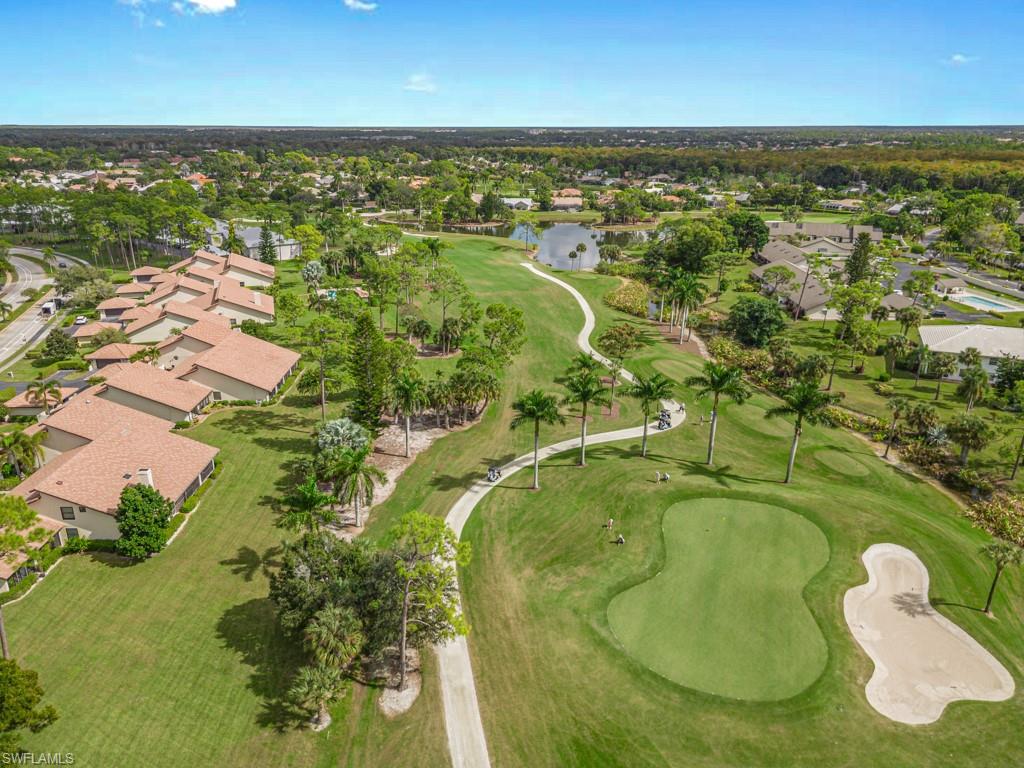 594 Augusta Boulevard, Unit 3 Naples, FL 34113 - Photo 19 of 20 an aerial view of residential houses with outdoor space and swimming pool