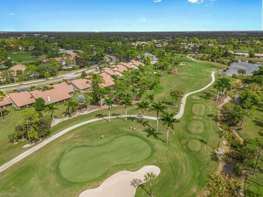594 Augusta Boulevard, Unit 3 Naples, FL 34113 - Photo 20 of 20 an aerial view of residential houses with outdoor space and swimming pool