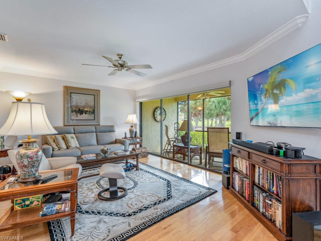 594 Augusta Boulevard, Unit 3 Naples, FL 34113 - Photo 3 of 20 a living room with furniture and a large window