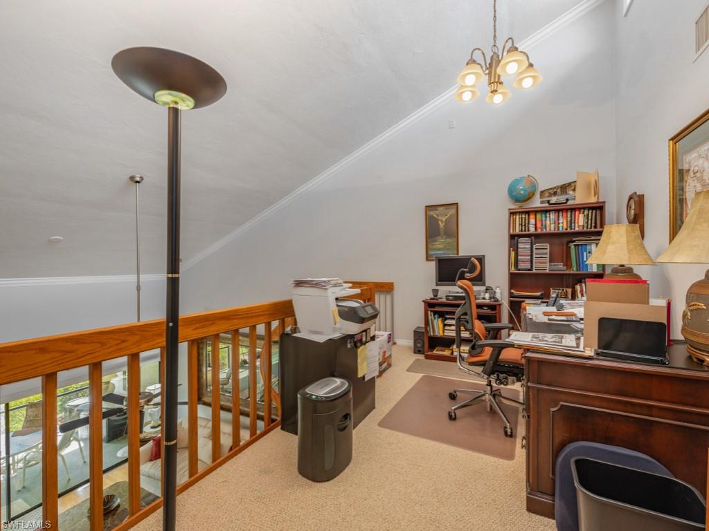 594 Augusta Boulevard, Unit 3 Naples, FL 34113 - Photo 9 of 20 a view of a workspace with furniture