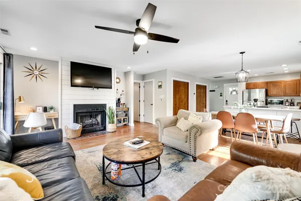 a living room with furniture fireplace and a flat screen tv