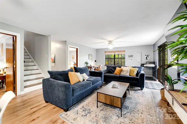 a view of a livingroom with furniture and a window