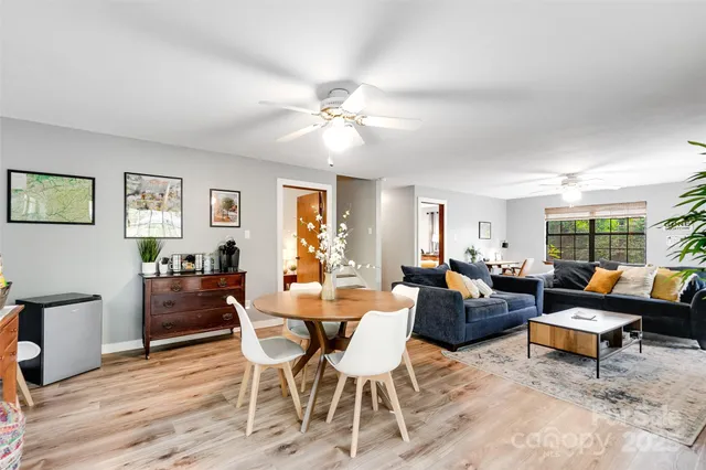 a bedroom with 2 bed and a window