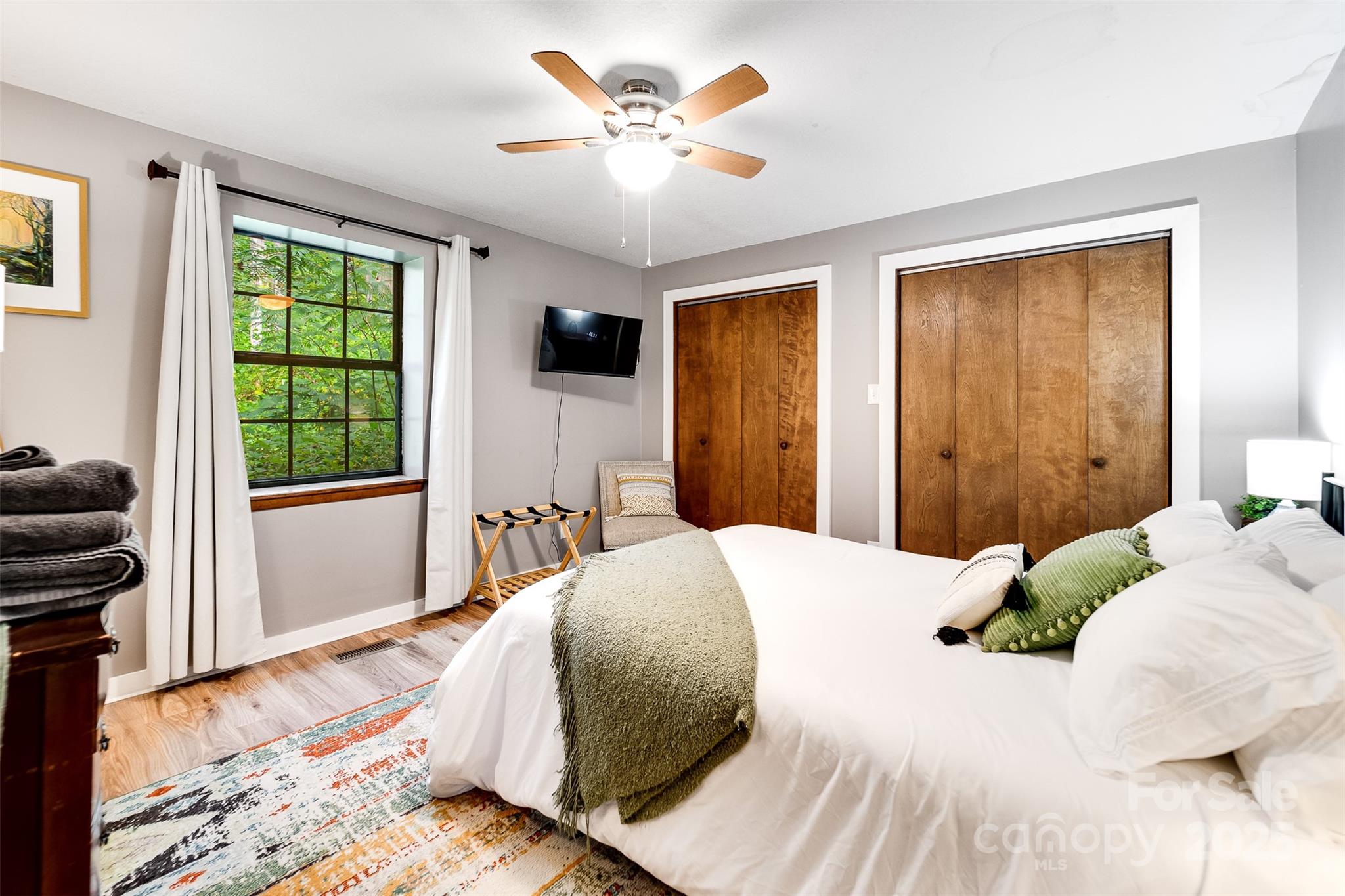 125 Nugget Lane Sylva, NC 28779 - Photo 18 of 30 a bedroom with a bed and a window