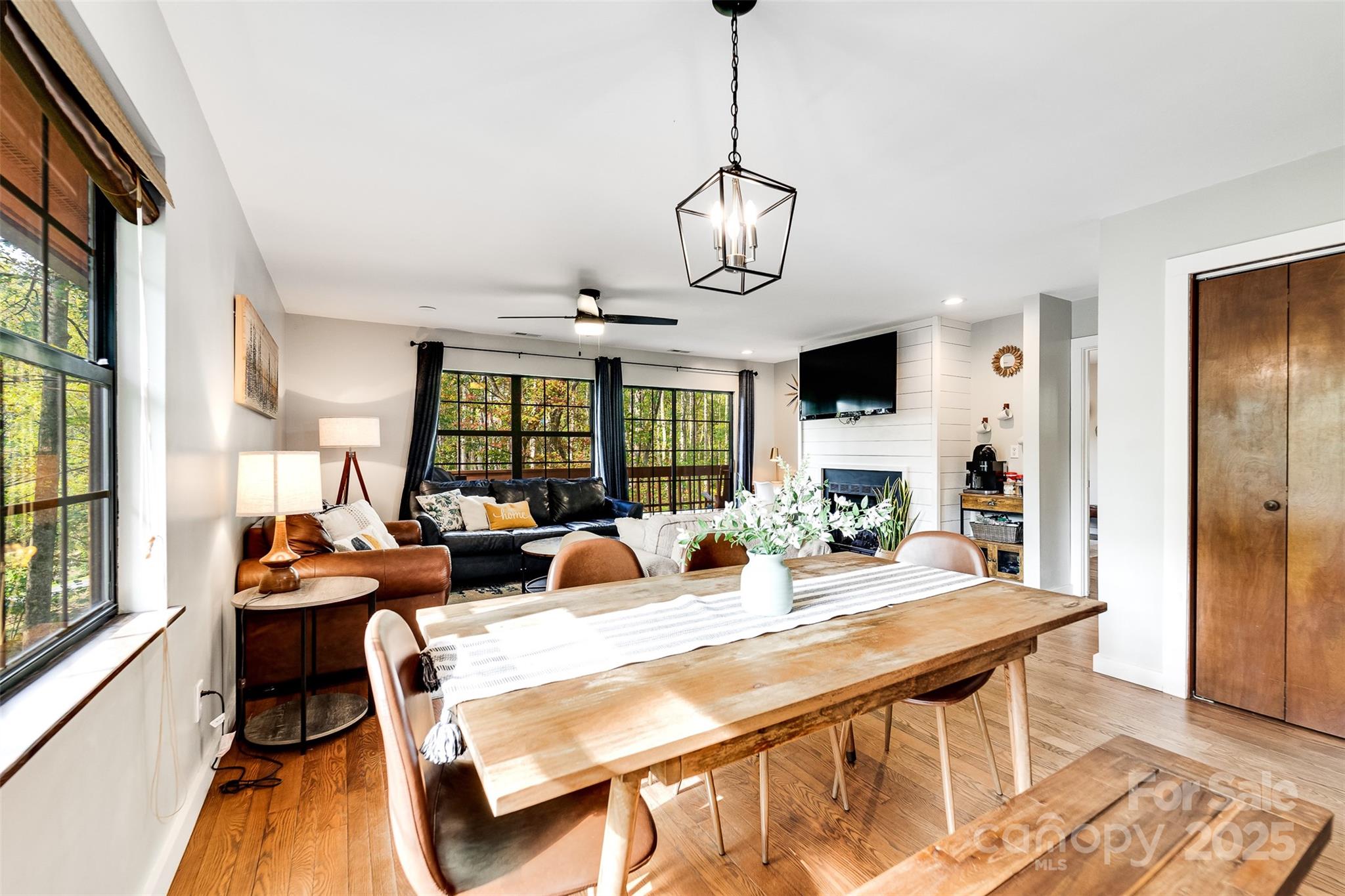 125 Nugget Lane Sylva, NC 28779 - Photo 2 of 30 a view of a dining room with furniture wooden floor and chandelier