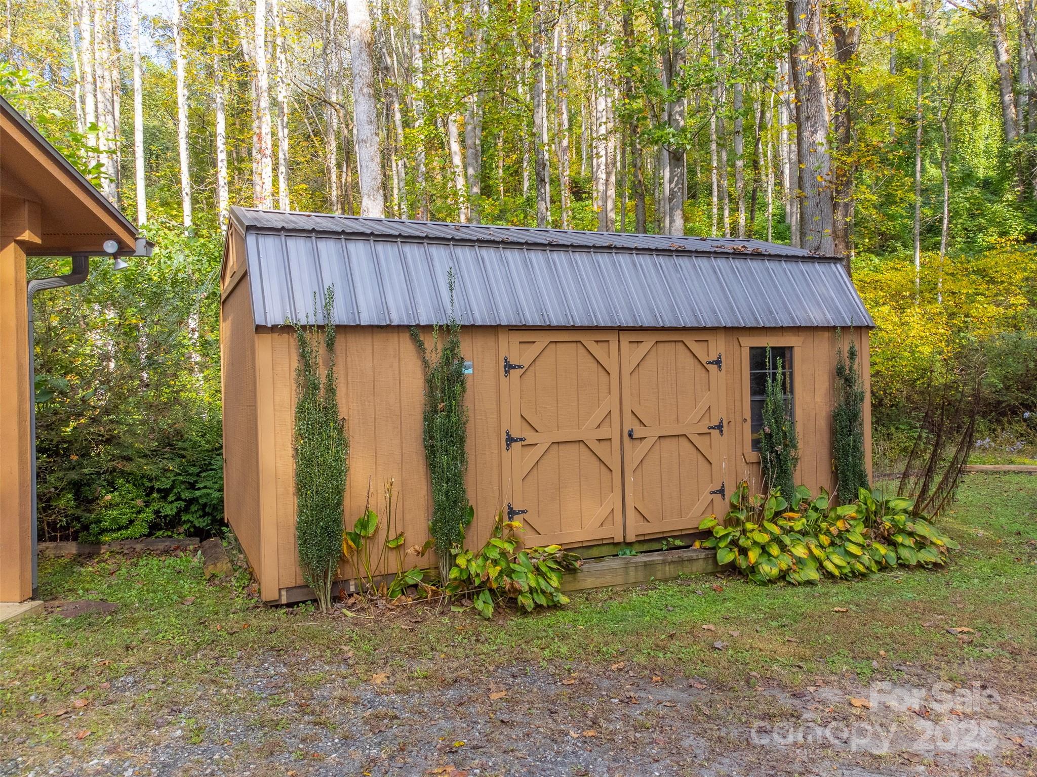 125 Nugget Lane Sylva, NC 28779 - Photo 23 of 30 a view of a house with backyard and garden