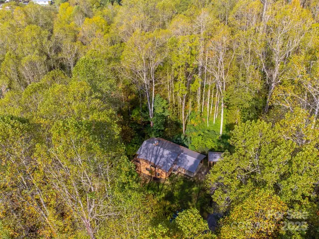 a view of a wooden balcony with a tree